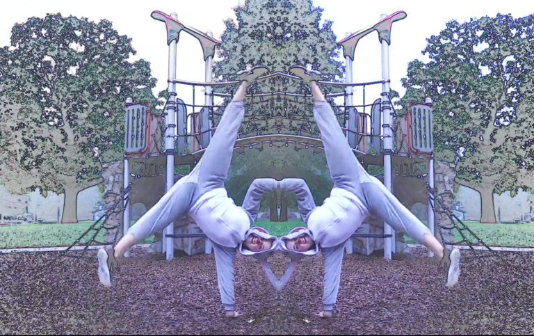 mirror image of dancer performing a handstand