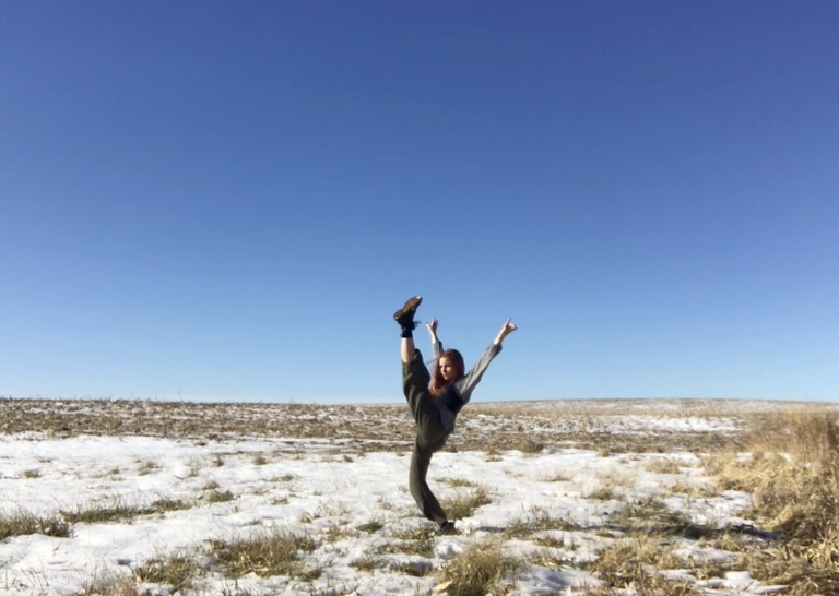 Alexsandria Wahl dancing in a field
