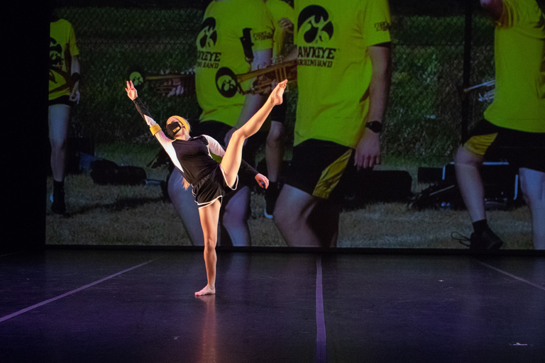 Dancer falling back with leg high