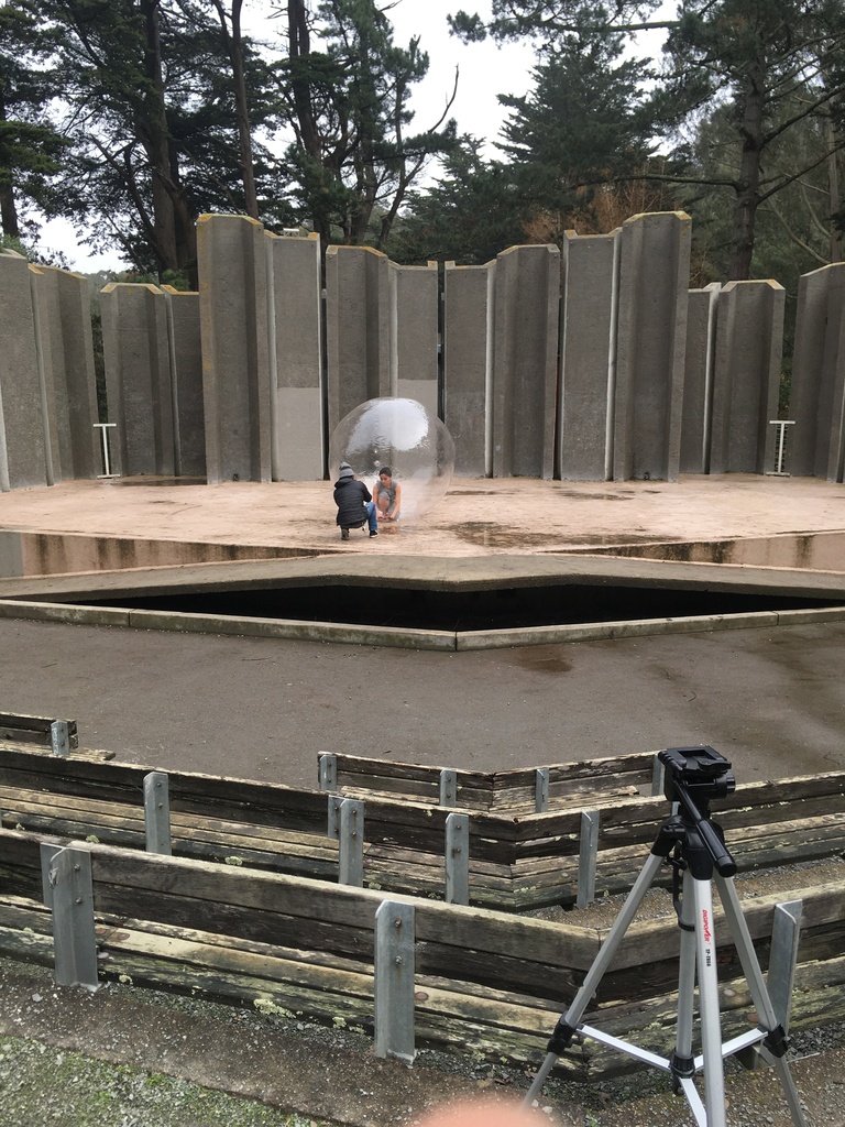 Dancer in a bubble on an outdoor stage