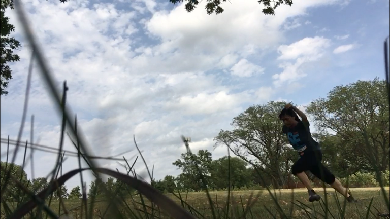 Dancer along wooded area
