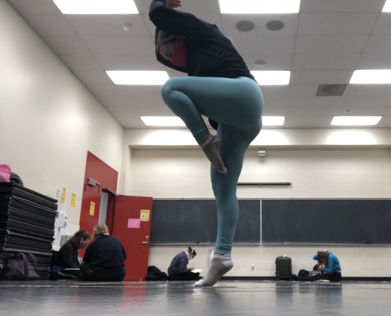 Dancer jumping in rehearsal