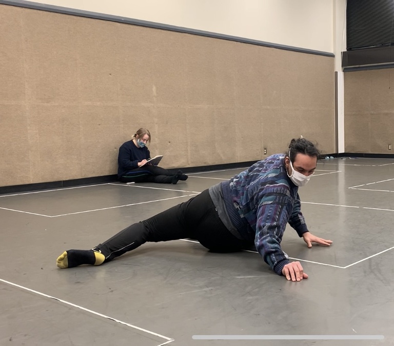 Dancer on floor in rehearsal