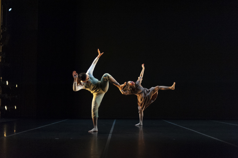 Two dancers performing on stage