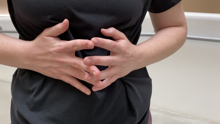 Dancers hands, fingers interlaced