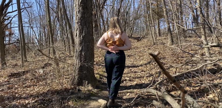 Dancer performing in a wooded area