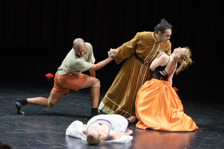 Four dancers in rehearsal.