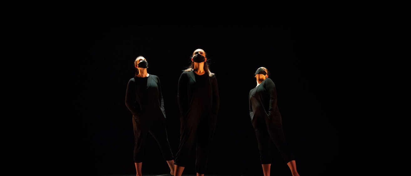 Trio of dancers looking up