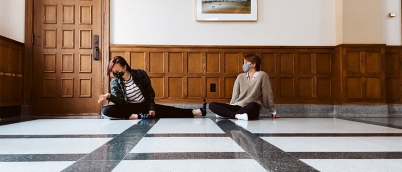 Two dancers performing on the floor