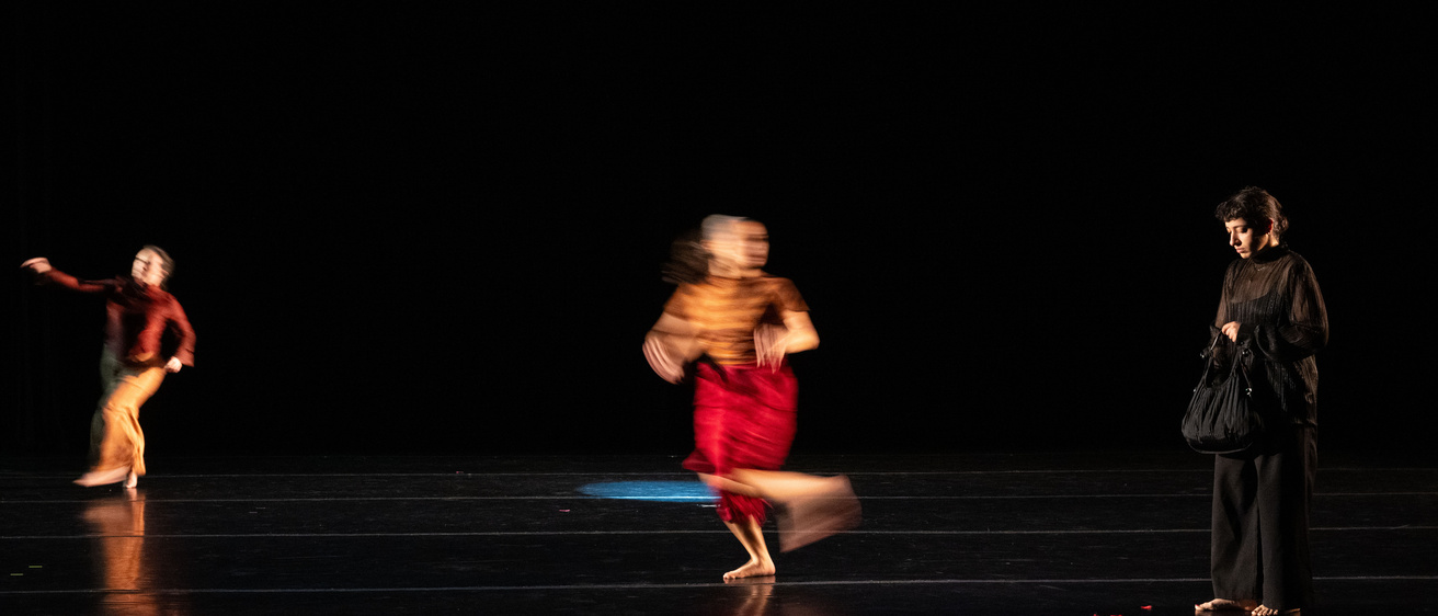 Blurred dancers in motion on stage at Space Place Theater