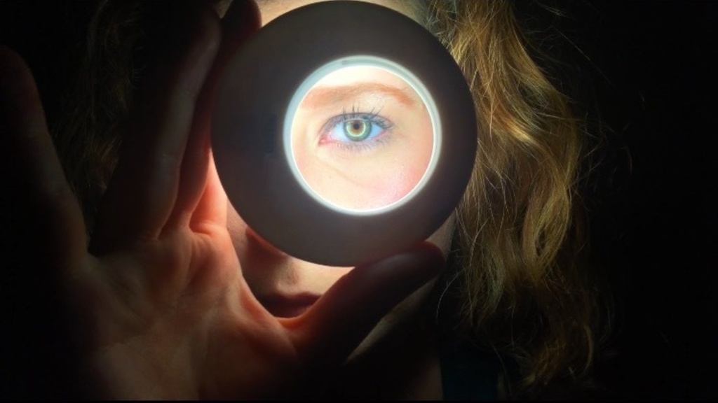 Close up of Anna Wetoska's eye, visible through ring light
