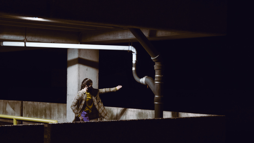 Dancer performing in a parking ramp