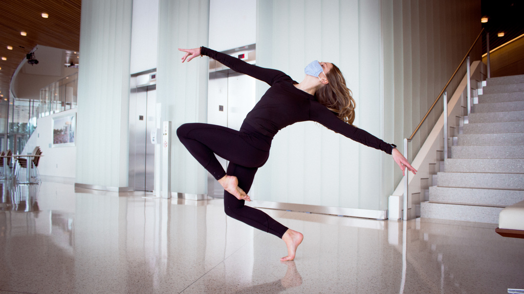 Lauren Macke dancing in front of an elevator