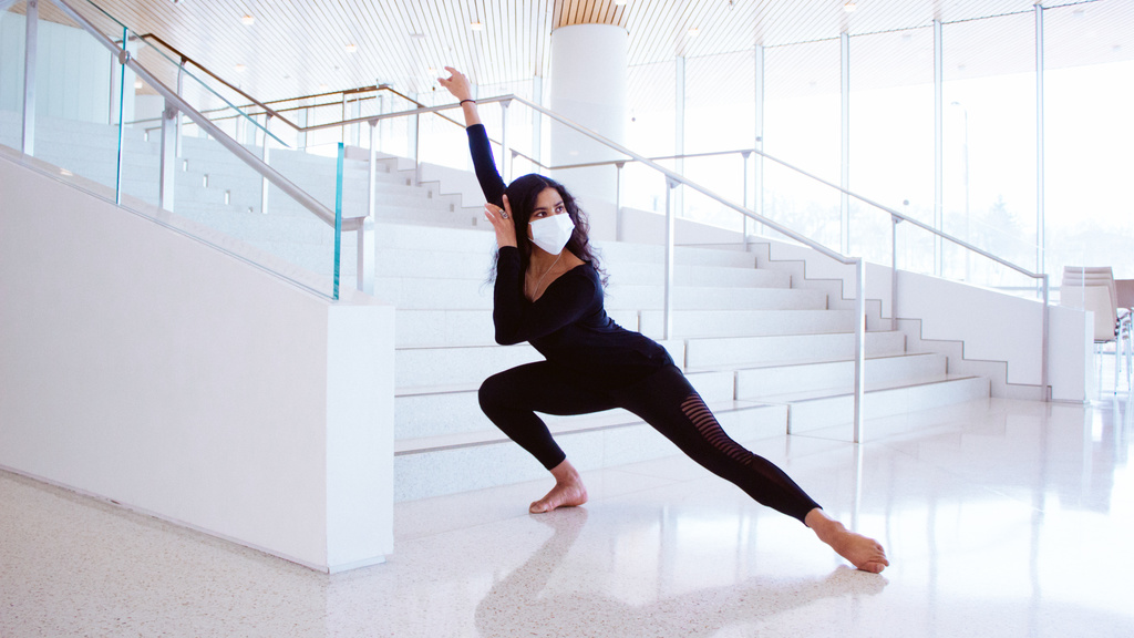 Dharmini Piekarska lunging in front of stairs