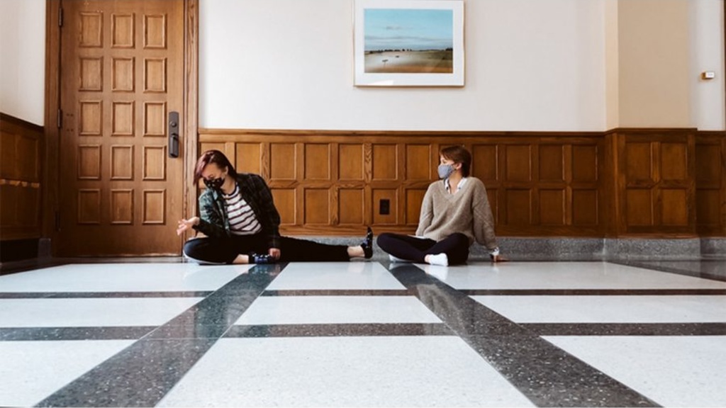 Two dancers performing on the floor