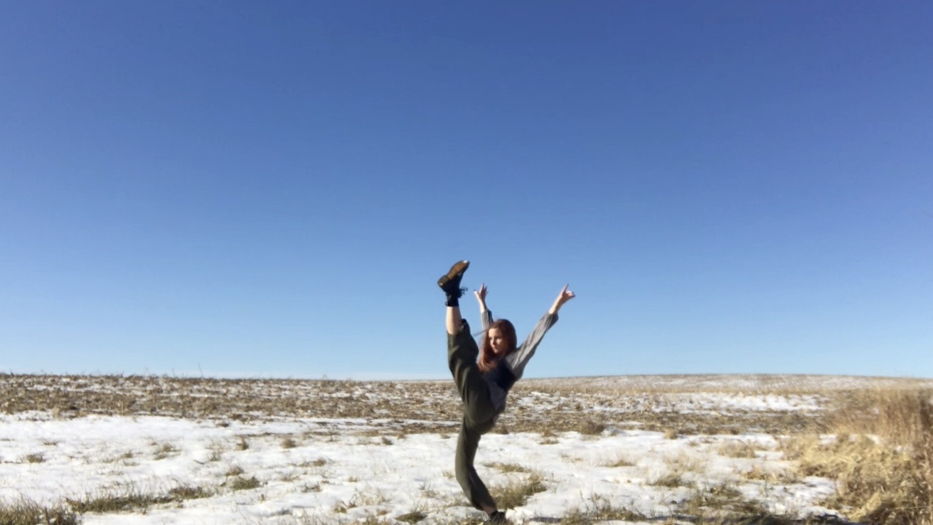 Alexsandria Wahl dancing in a field
