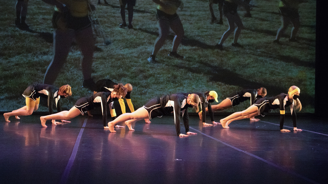 Group of dancers in a plank position
