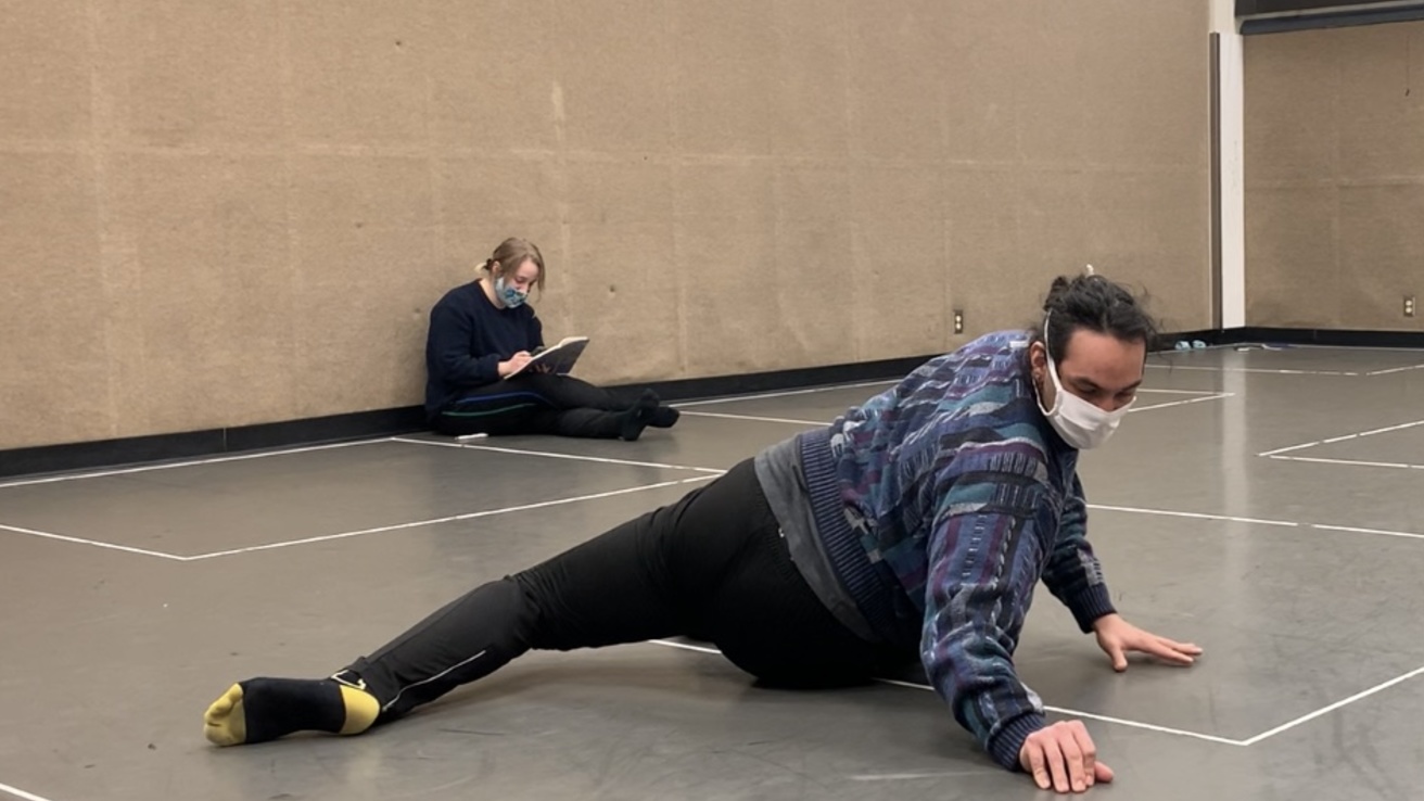 Dancer on floor in rehearsal