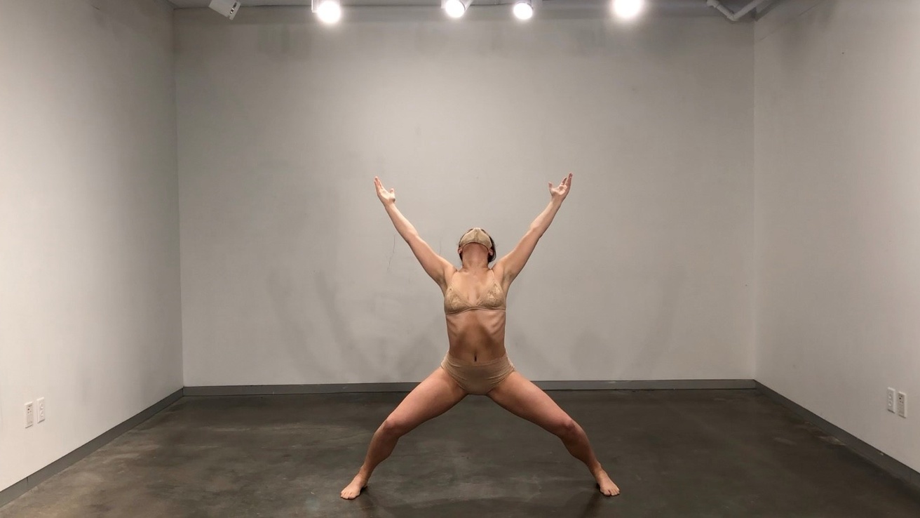 Dancer in performance in an empty room