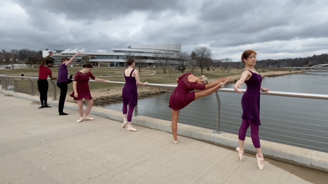 Dancers on bridge over the Iowa River.