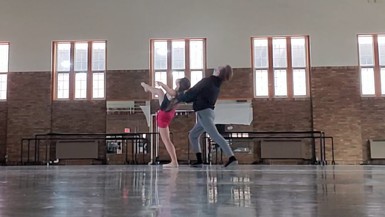 Two dancers performing in Halsey Hall.