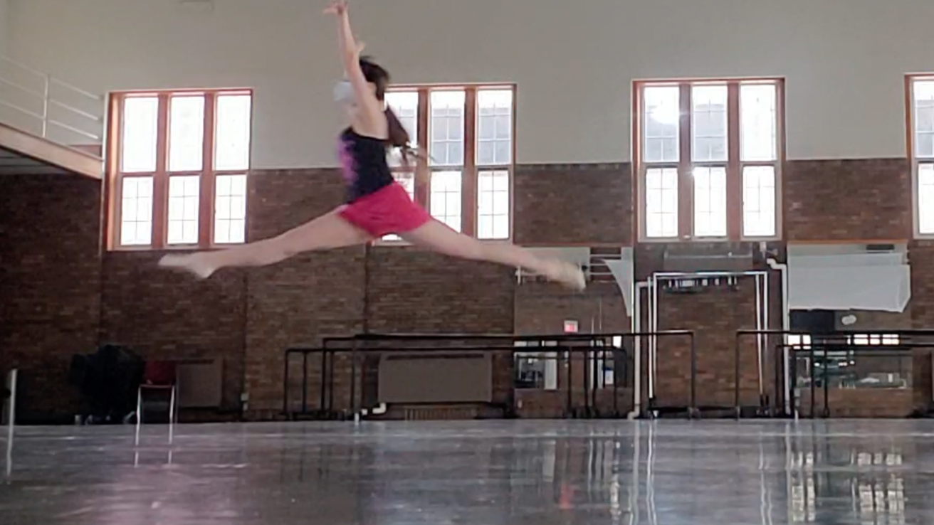 Dancer leaping in the air.